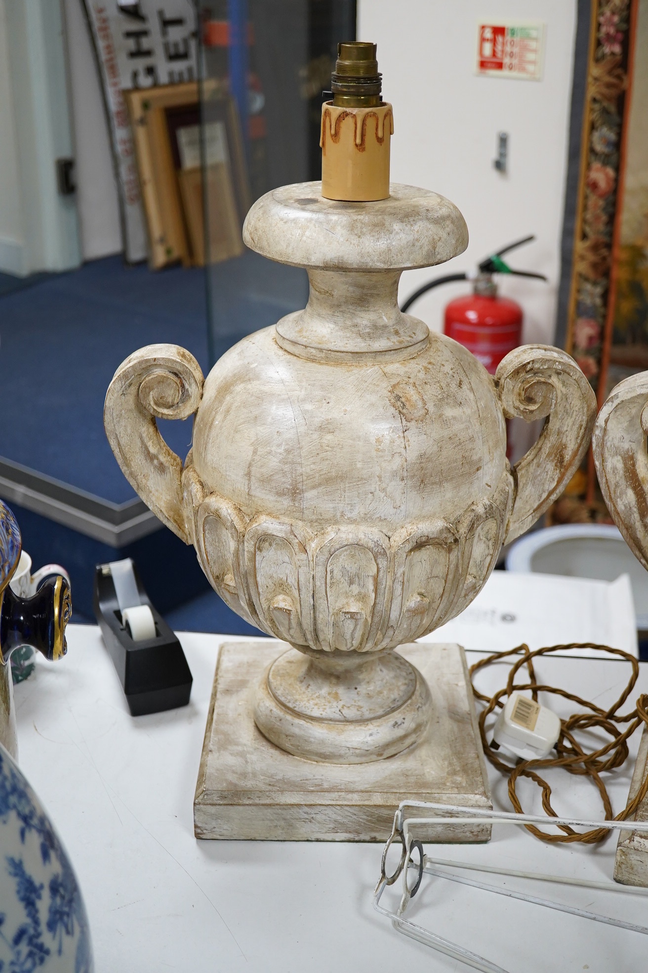 A pair of carved and painted wood table lamps, 44cm excluding fittings. Condition - fair to good, not tested